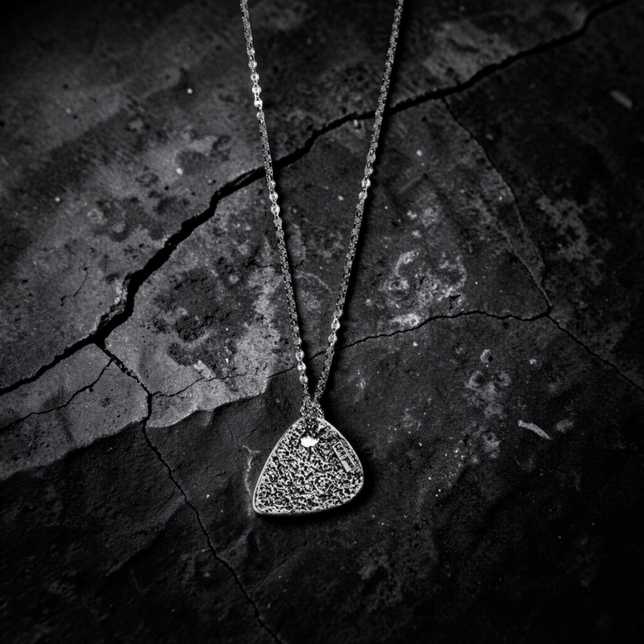 SILVER HAMMERED GUITAR PICK