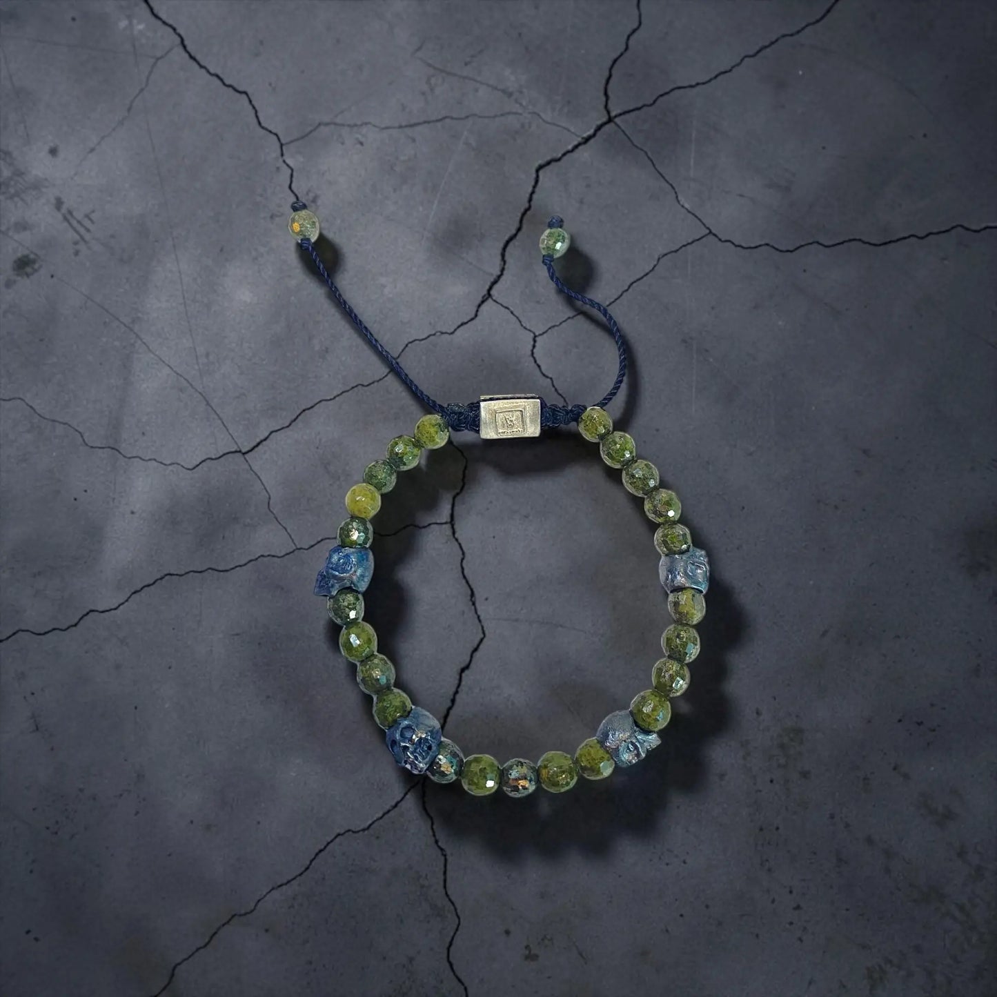 5 SKULLS GREEN PIRITE BRACELET